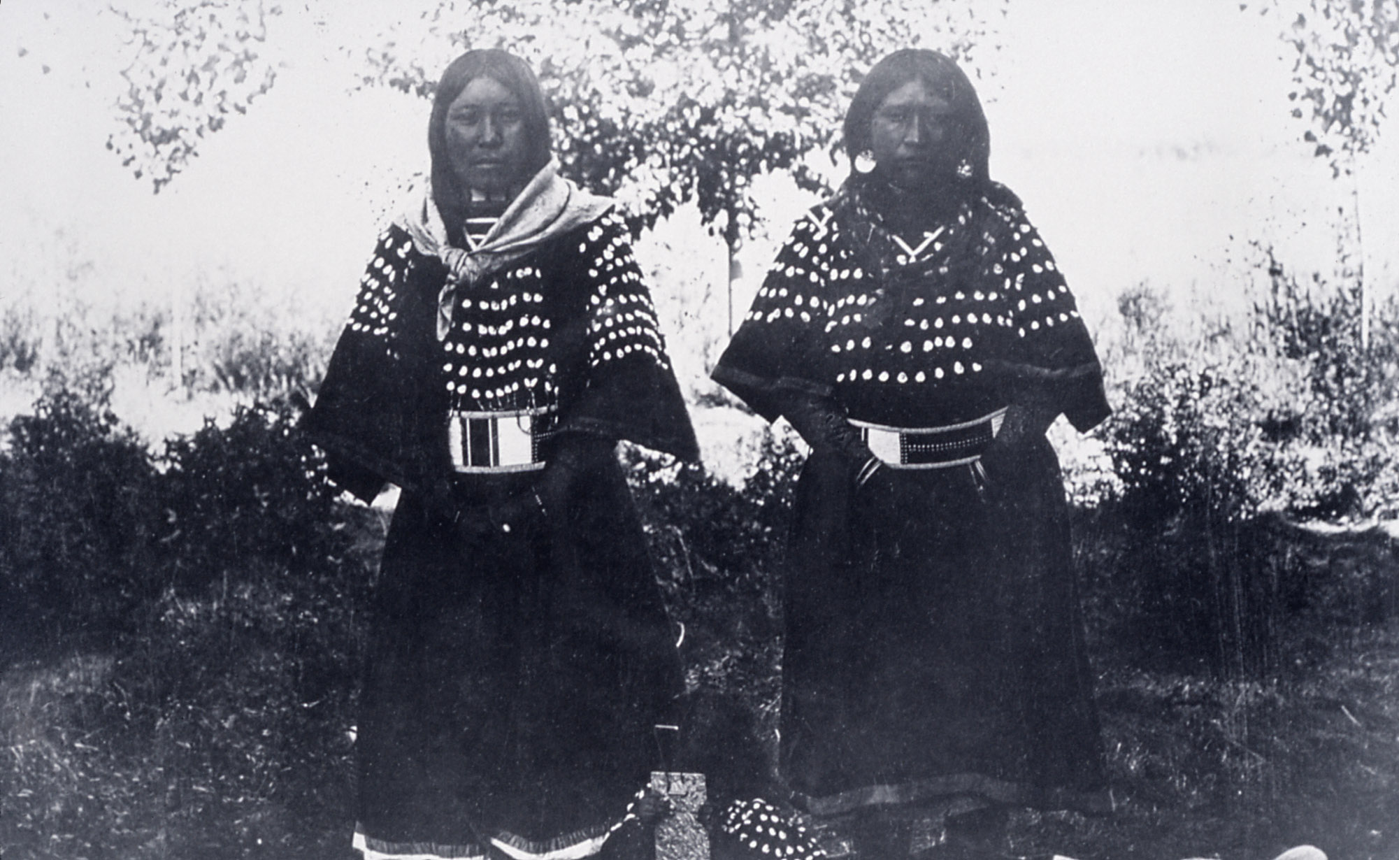 Bannock girls in dress decorated with elk teeth; Photographer unknown; No date; History - Indians